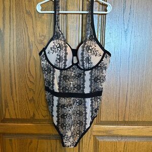 Frederick’s of Hollywood nude and black bodysuit